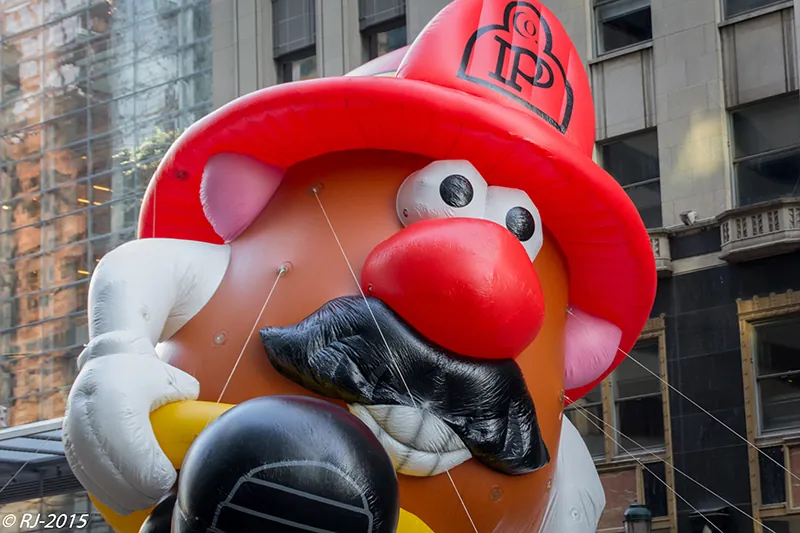 A photo shows a Mr. Potato Head balloon floating at the Thanksgiving Day parade in New York City.