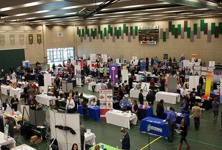 This is a photograph of people at a job fair.