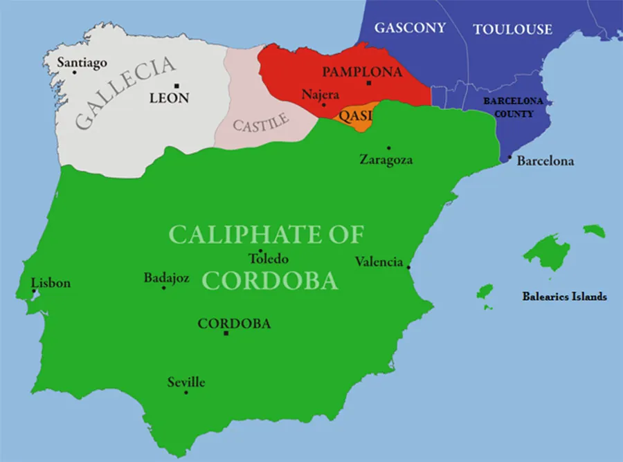 A map shows a peninsula of land with water on three sides connected to land at the northeast section. The water is highlighted blue. The southern section of the peninsula as well as islands to the east are highlighted green. The land is labelled “Caliphate of Cordoba.” The islands are labelled the “Balearics Islands.” Cities labelled within the green land are, from north to south: Zaragoza, Lisbon, Badajoz, Toledo, Valencia, Cordoba (in all capital letters), and Seville. To the northwest, an oval section of the peninsula is highlighted white and labelled “Gallecia.” The city of Santiago is labelled in the northwest and the city of Leon (in all capital letters) in labelled in the west. Heading east there is a triangle shaped area of land highlighted light pink labelled “Castile.” East of “Castile” an oval area is highlighted red and labelled “Pamplona” with the city of Najera labelled in the southwest. South of “Pamplona” is a tiny oval area highlighted orange and labelled “Qasi.” Northeast of the orange and green areas is an area highlighted dark blue, but separated into three areas. The area closest to Pamplona is labelled “Gascony.” To its east is an area labelled “Toulouse.” South of both of those is an area labelled “Barcelona County” with the city of Barcelona labelled on the coast.
