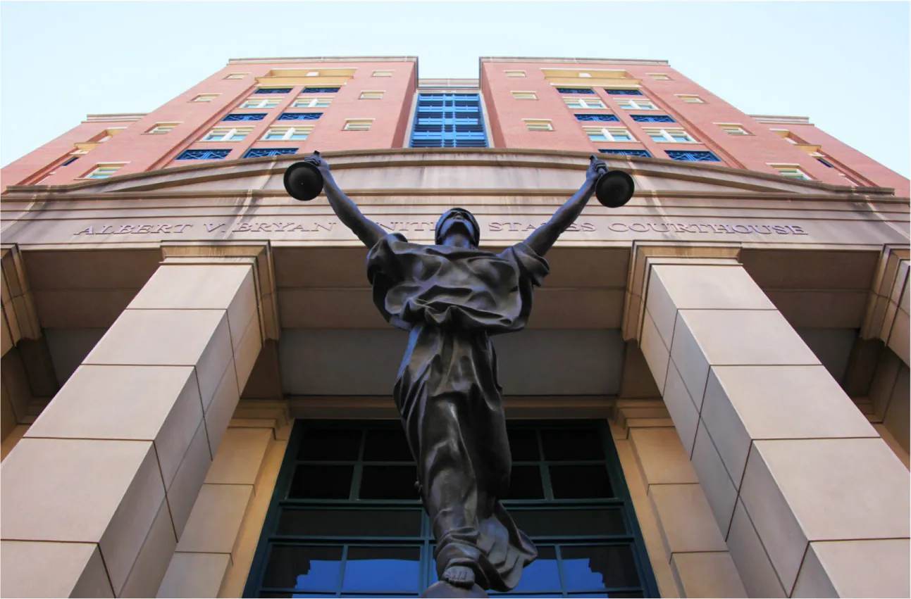An image of a statue depicting justice, with arms outstretched.