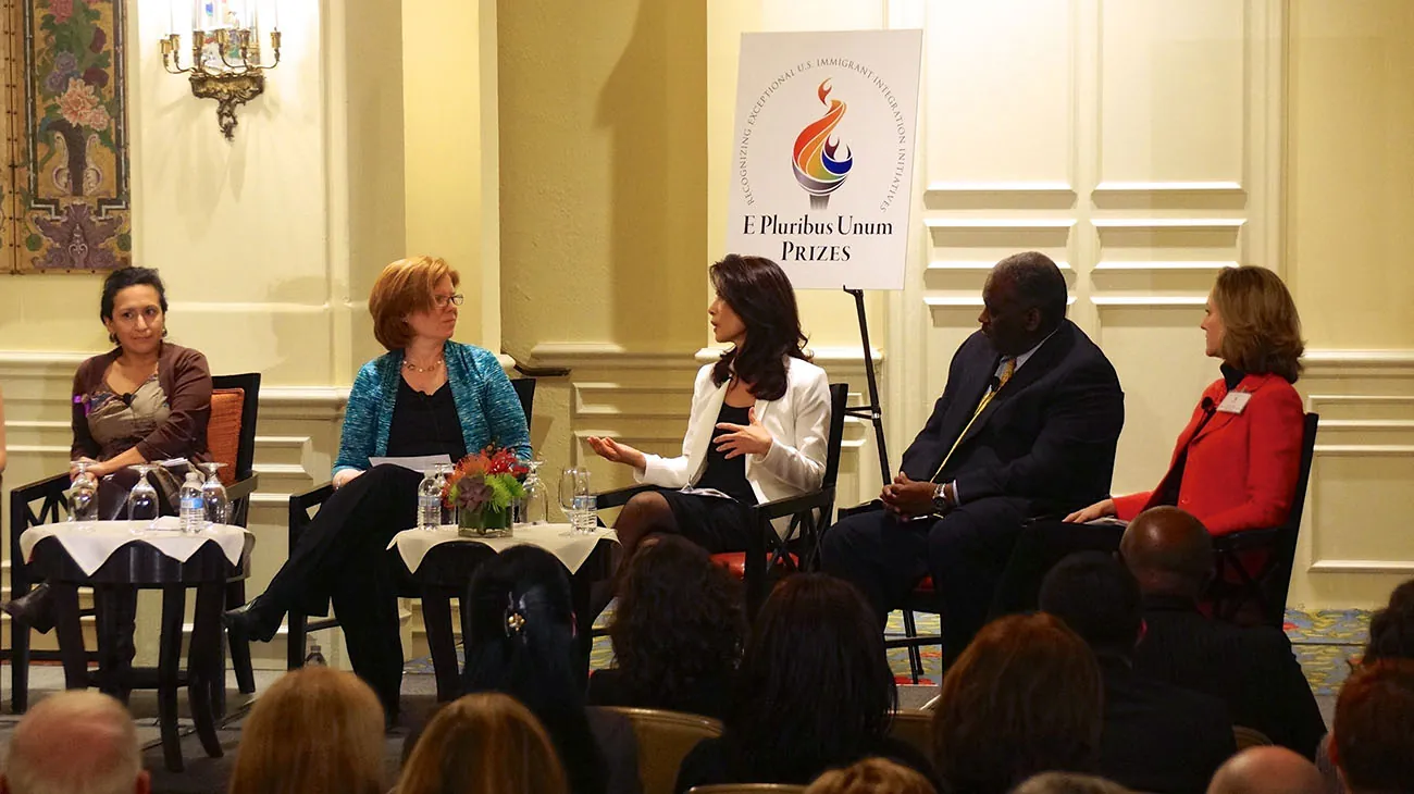 A photo shows a diverse team of experts of Kaiser Permanente participating in a panel discussion during the E Pluribus Unum Prizes Ceremony.