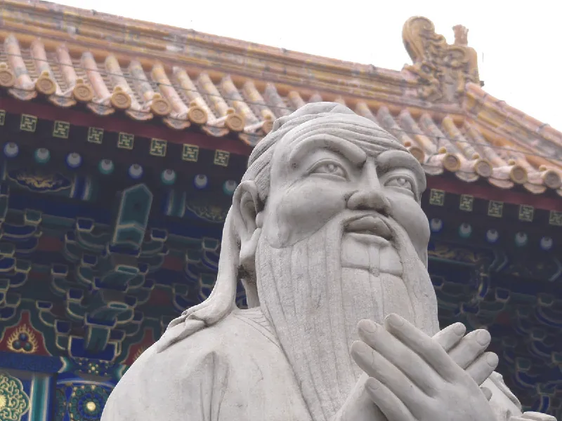 A photo of a statue depicting Confucius that is in front of the Confucius Temple.
