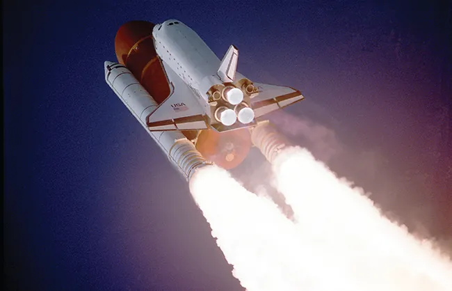 A rocket is shown taking off.