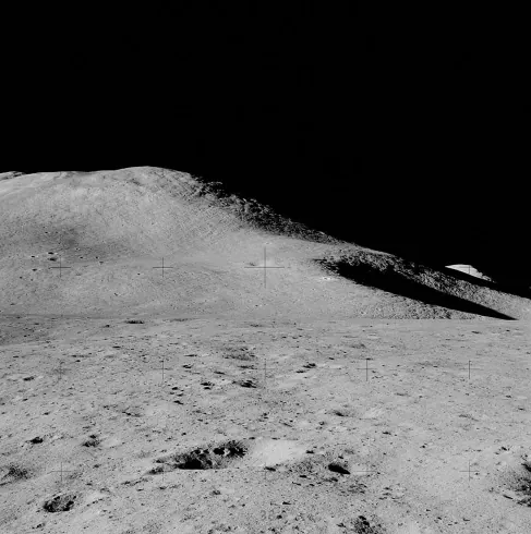 Photograph of a Lunar Mountain. The smooth contour of Mt. Hadley is seen against the inky blackness of space.