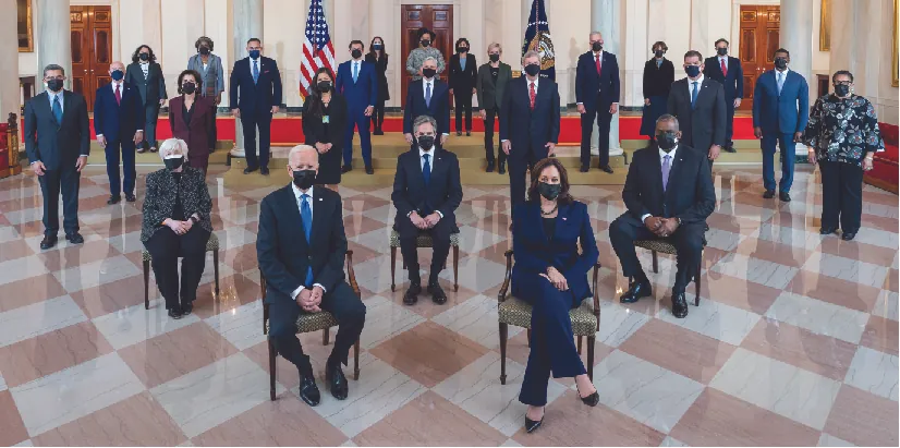 President Joe Biden and Vice President Kamala Harris and Presidential Cabinet members in the Grand Foyer of the White House. Seated in the second row, from left, are: Treasury Secretary Janet Yellen, Secretary of State Antony Blinken, and Defense Secretary Lloyd Austin. Standing in the third row, from left, are: Health and Human Services Secretary Xavier Becerra, Commerce Secretary Gina Raimondo, Interior Secretary Deb Haaland, Agriculture Secretary Tom Vilsack, Labor Secretary Marty Walsh, and Housing and Urban Development Secretary Marcia Fudge. Standing in the fourth row, from left, are: Homeland Security Secretary Alejandro Mayorkas, Attorney General Merrick Garland, and Environmental Protection Agency Administrator Michael Regan. Standing in the fifth row, from left, are: Small Business Administrator Isabel Guzman, U.S. Permanent Representative to the United Nations Linda Thomas-Greenfield, Education Secretary Miguel Cardona, Transportation Secretary Pete Buttigieg, Energy Secretary Jennifer Granholm, Veterans Affairs Secretary Denis McDonough, Council of Economic Advisers Chair Cecilia Rouse, and Chief of Staff Ron Klain. Standing in the sixth row, from left, are: National Intelligence Director Avril Haines, Office of Management and Budget Acting Director Shalanda Young, and U.S. Trade Representative Katherine Tai.