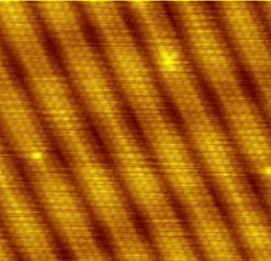 An image of gold taken by a scanning tunneling microscope shows individual gold atoms.