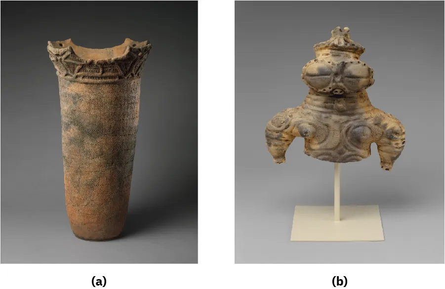 Two photographs of ancient pottery are shown on gray backgrounds. (a) A tall orange and black round container is shown with a large, open top with décor carved around the square and round edges that jut out. The long body of the container is imprinted with a textured surface. (b) An ancient artifact is shown displayed on an off white pole attached to a square, flat stand. The object is pale orange and gray. A face shows with oversized round, closed eyes, only showing a slit. The nose is a small hole in between the eyes and the mouth is a small almond shape under the nose. The hat on top is round with a broken point at the top. The thick neck is encircled with four thick lines. The short torso shows swirls carved into it and the arms are short, thick at the shoulders and thin at the bottom, ending in broken stumps.