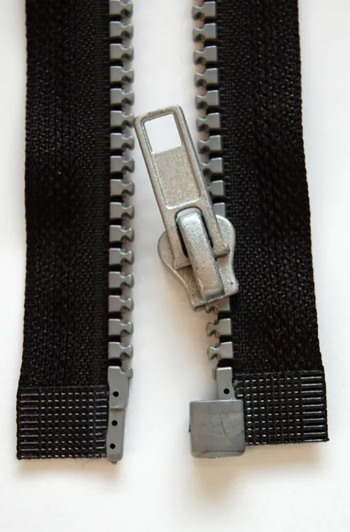 Figure (b) shows a modern zipper.