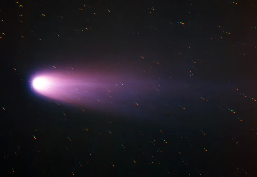 Halley in 1986. The bright head of this famous comet is seen at left, with the dust and ion tails extending to the right.