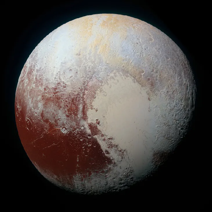 A global color image of Pluto, showing a dark area in the lower left covered with impact craters, and a larger light area in the center and lower right that is flat.