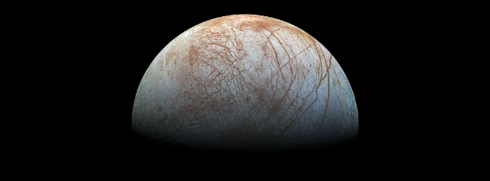 Europa. The surface of Europa is covered with networks of long cracks and large areas of jumbled terrain suggestive of geologic activity.