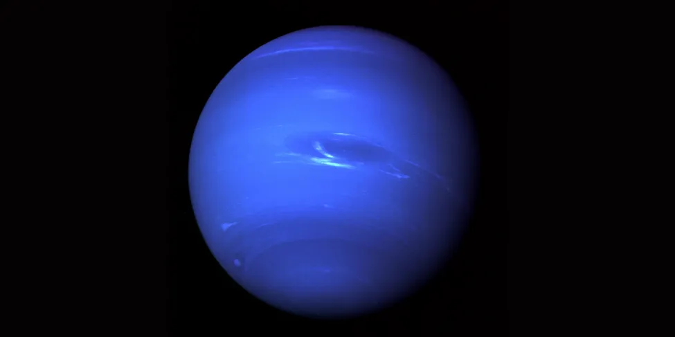 Blue Neptune. The blue sphere of Uranus is nearly featureless, save for dark bands near the poles, a few scattered white clouds, and a dark spot (near the center in this image) similar to the Great Red Spot on Jupiter.