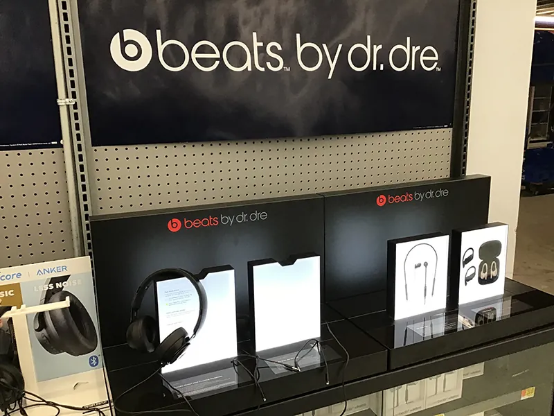 Different beats by Dr. Dre products are shown in a store display.