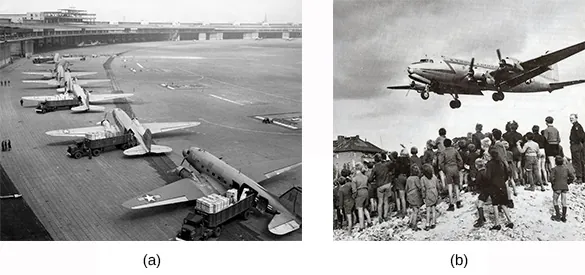 Photograph (a) shows a row of C-47 transport planes awaiting takeoff. Photograph (b) shows a crowd of German men, women, and children watching as a plane above them prepares to land.