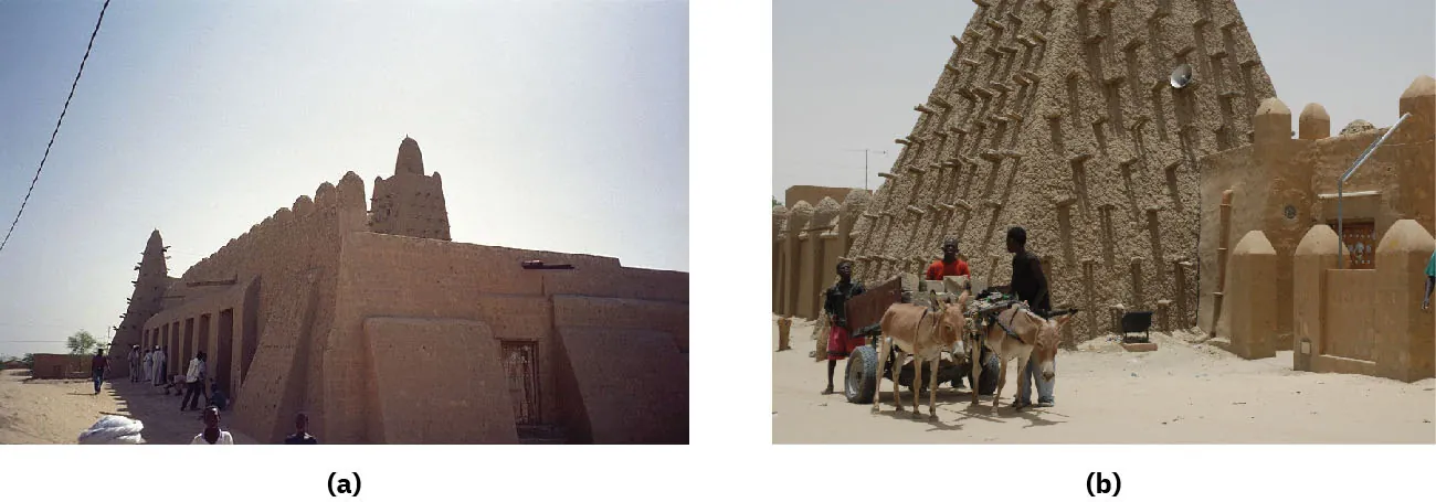 Two images of photographs are shown. (a) This image shows a sandy-colored stone buildings with tall rectangular doors on the left. Triangle shaped projections come out of the building on the front and left sides shown. The left wall is taller and scalloped at the top. A tower with projections on all sides sits in the middle of the roof. The ground is brown and sandy and people are seen standing around on the left side in white shorts, long white robes, and white turbans. A wire runs through the image at the top left. (b) this image shows a tall pyramid shaped structure with dark projections sticking out the sides. Adjacent brown sandy buildings are in front of and behind the pyramid structure. They have walls with rounded tops and brown wooden doorways. A cart with two donkeys pulling it is shown in the bottom left corner with three dark skinned people in shirt and pants/shorts standing around it.