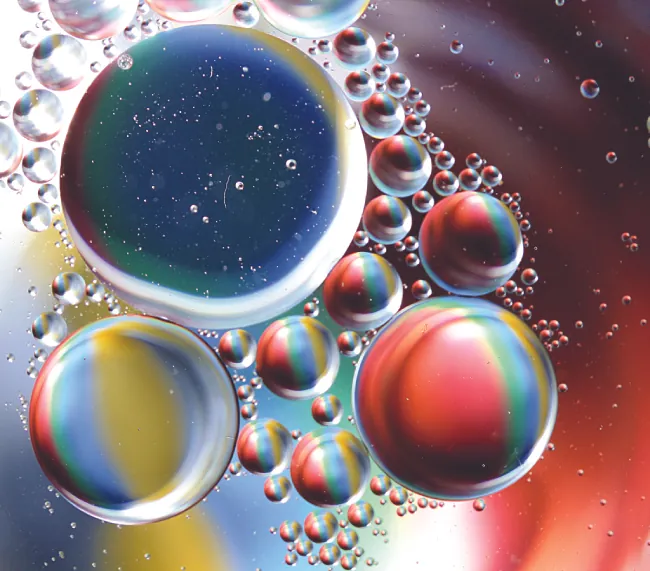 This photo shows an array of colors in an oil water mixture.