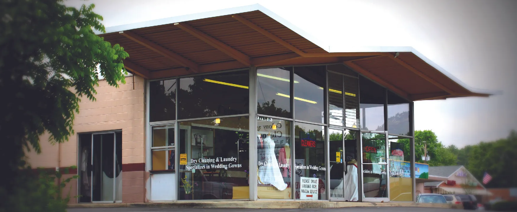 Exterior photograph of dry-cleaning business.