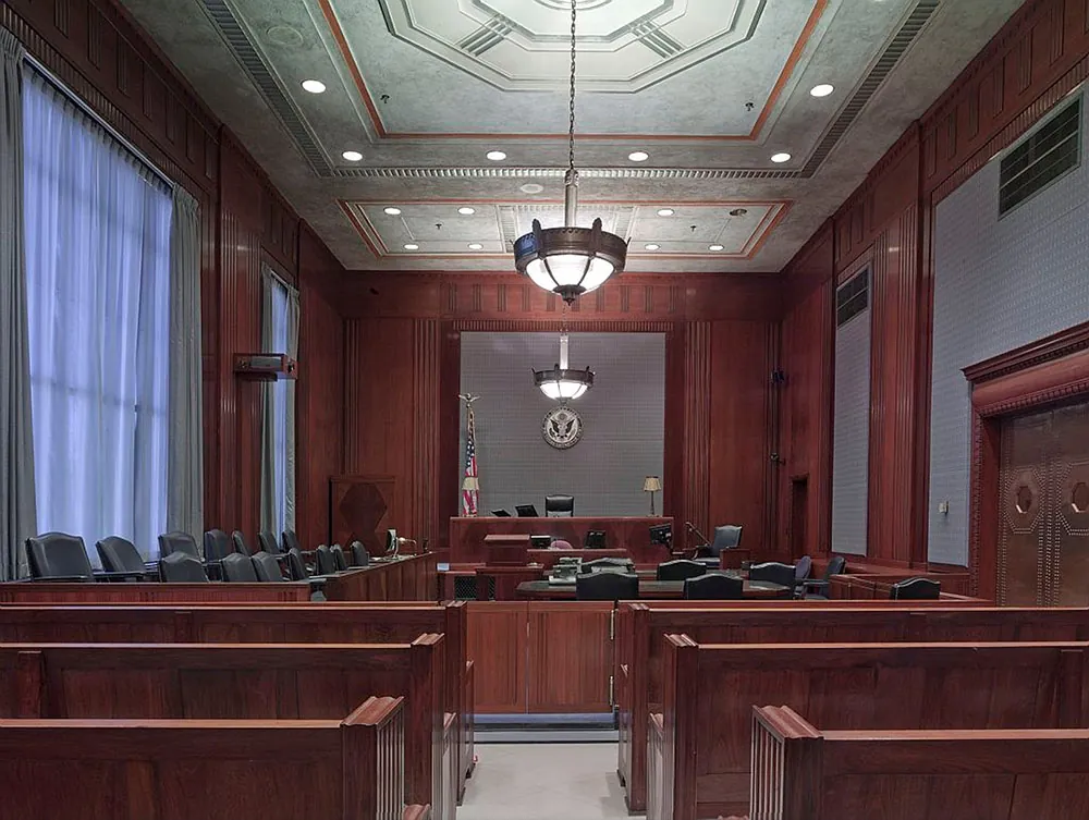 An photo shows an empty courtroom.