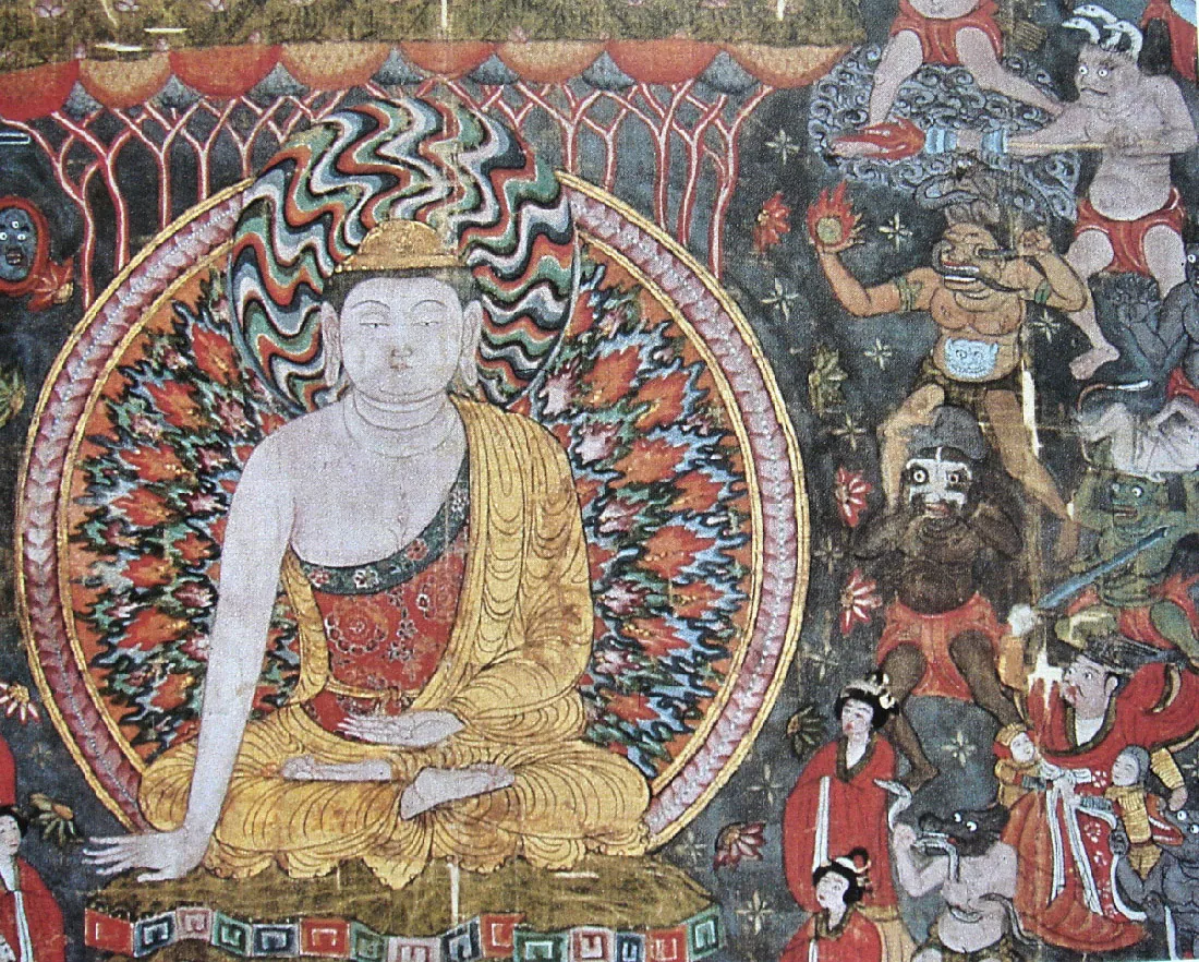 An image of a highly detailed painting is shown. In the left half of the image, a bluish-gray figure sits cross legged with the bottom of his feet facing up. He wears a rich gold robe on top of a red and green intricately detailed cloth. He has black short hair, wears a rounded gold hat, has long earlobes, and rests one hand on the green and black ground next to him with the other in his lap with an upturned palm. His head is surrounded in a circle of zigzagged black, red, blue and black lines while the rest of his body is surrounded in a circle of designs resembling fire in the same colors with a border of light red and white designs. Flowers surround the image on the right and left side and white and light red lines sprout from the top to colorful half circles. Below the image are colorful designs and a figure in red in the bottom left corner. The right side of the image displays a variety of figures. At the top, the bottom half of a gray man is shown in a red loincloth. Next, a gray colored man with three white serpents coming out of his head wears a red loincloth and holds a long stick with red fire sprouting out of the end. Below him a brown colored man stands in a black loincloth with a monster’s face drawn on his belly. Serpents comes out of his eyes and mouth and he holds a ball of red fire in his right hand. Below him two dark colored figures stand, one holding a white mask to his face while the other holds a gray person above his head. In the bottom right corner, a large man in red robes, black moustache and black cap holds a sword in the air while to smaller figures in armor and helmets cling to his waist. An animal in a white shirt holds a snake in his paws and bites it in the middle. Two women in red robes and black hair stand in front of the animal.