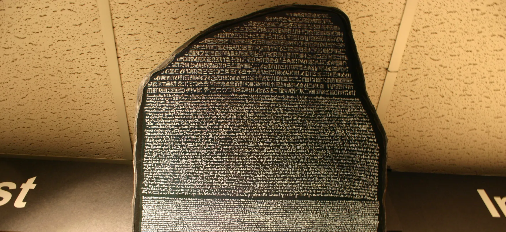 The Rosetta Stone shows a script made up of small pictures and text, also called Egyptian hieroglyphs.