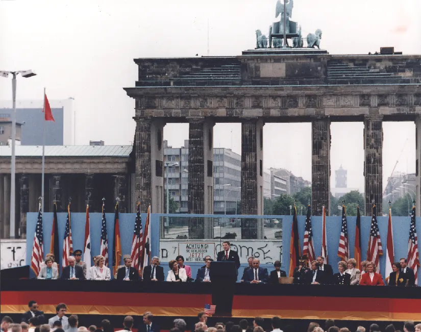 A photo of Ronald Reagan giving a speech in Berlin.