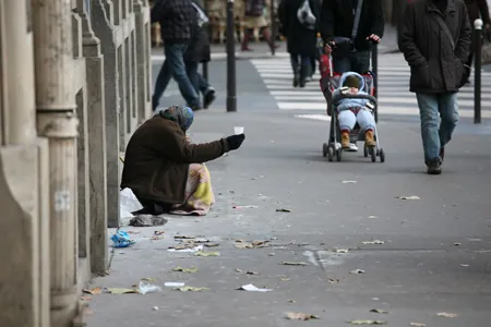 In figure (b), a homeless person, dressed in shabby clothing, is shown sitting on a city sidewalk, holding a plastic cup, begging for change from passers-by.