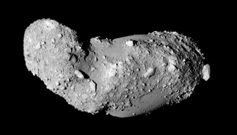 Asteroid Itokawa. This elongated asteroid has no craters and appears to be covered with loose piles of rock.