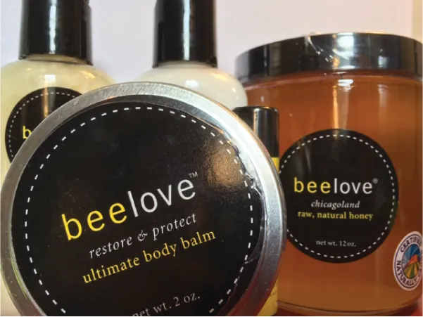 Photo of Bee Love ultimate body balm and raw, natural honey.