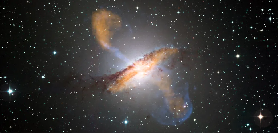Composite View of the Galaxy Centaurus A. This massive galaxy is dominated by a huge dust lane that runs across the face of the galaxy from lower left to upper right in this composite image. Superimposed on the visible light image are sub-millimeter (orange) and X-rays (blue). The X-rays clearly show jets emerging from the core perpendicular to the dust lane, with sub-millimeter radiation at the ends of the jets and in the dust lane.