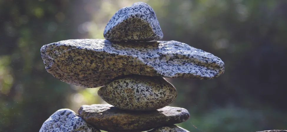This is a photo of several rocks carefully stacked to achieve balance.