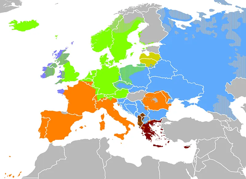 A European map uses different colors to depict different language families spoken in various regions of Europe. Much of western Europe, Italy, and parts of south-eastern Europe share an orange color; much of central Europe, parts of Britain and Ireland, and former Soviet countries share a blue color; while parts of Britain, Ireland, Germany, and Scandanavia share green color. Greece is highlighted in dark red color.