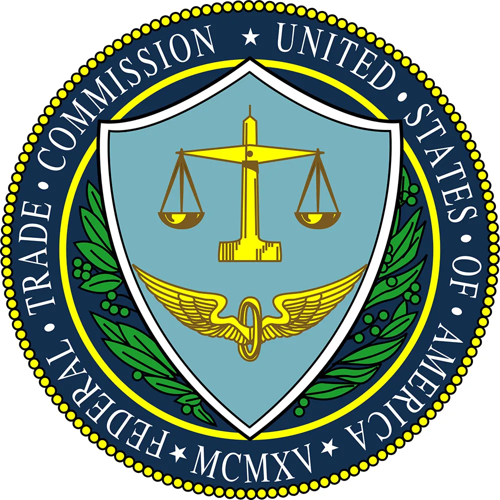 The seal with the words “Federal Trade Commission, United States of America, MCMXV” around the edge. In the middle are a balanced scale and wings.