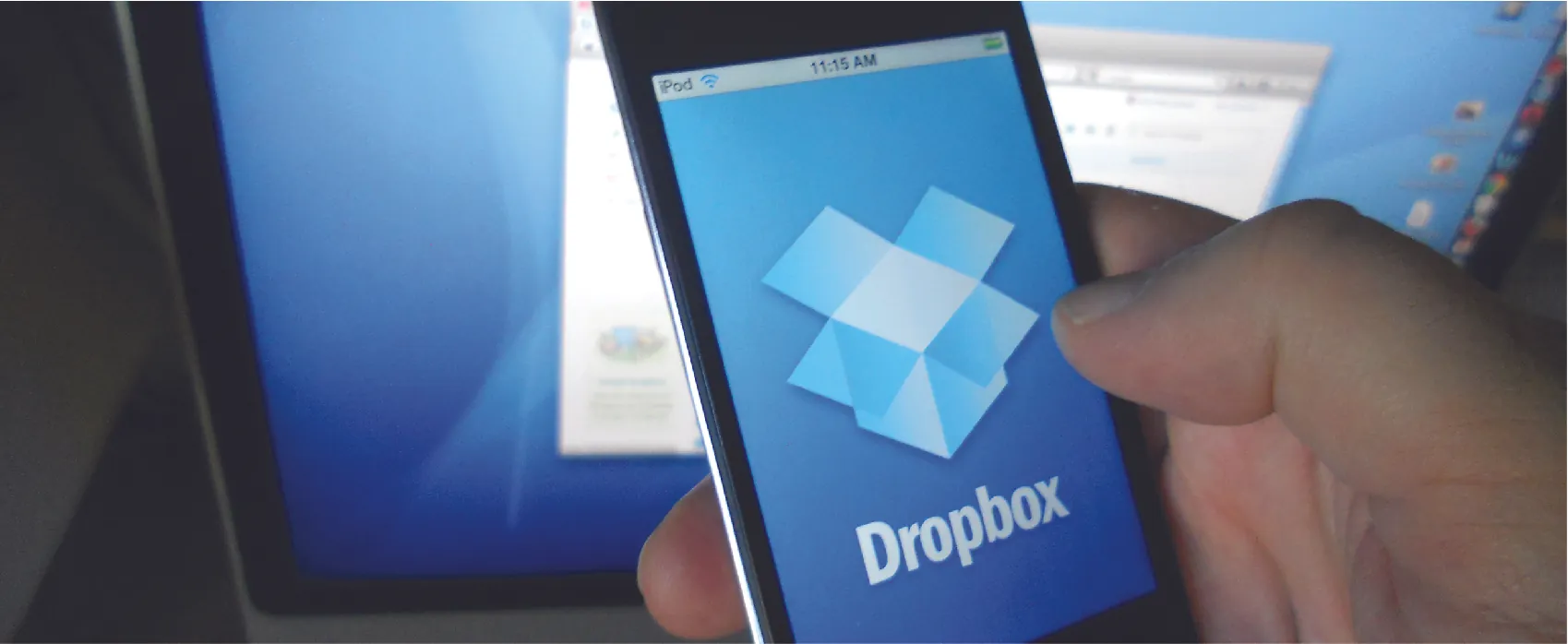 Photo of a cell phone with the Dropbox app open on the screen.
