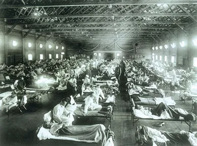 A photograph shows a massive hospital ward filled with flu victims.