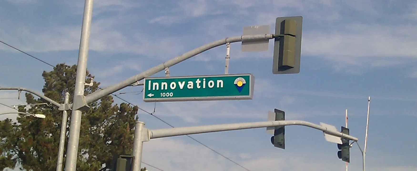 A photograph shows a street sign, and the street is named Innovation