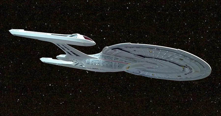 Zdjęcie statku Enterprise z serialu „Star Trek” na tle rozgwieżdżonego nieba.