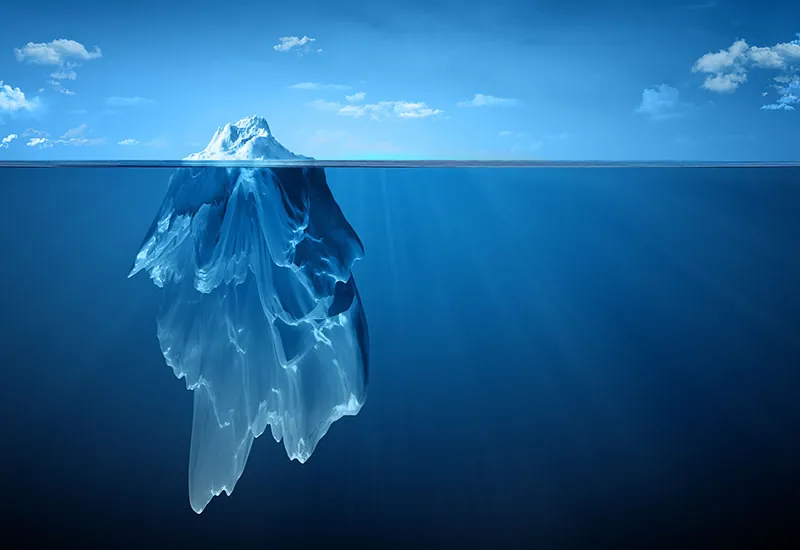 An iceberg, which is visible above and below the water, serves as a metaphor for the aspects of culture that seem “hidden” or invisible.