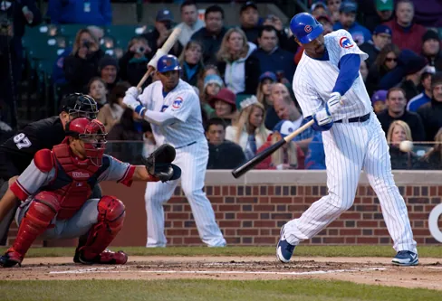 Photo of a baseball batter swinging.