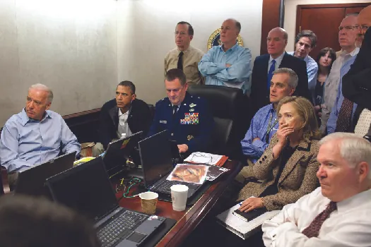 An image of Barack Obama, Joe Biden, Hillary Clinton, Robert Gates, and other national security advisors in the White House Situation Room.