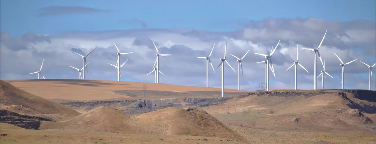 A photograph shows a windfarm.