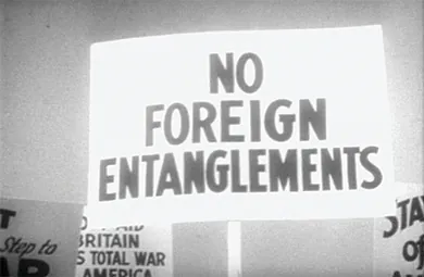 A protest sign reads “NO FOREIGN ENTANGLEMENTS.”