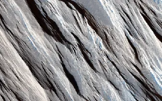 Martian wind erosion. The long, straight wind-blown ridges cross this image from the upper left to the lower right.