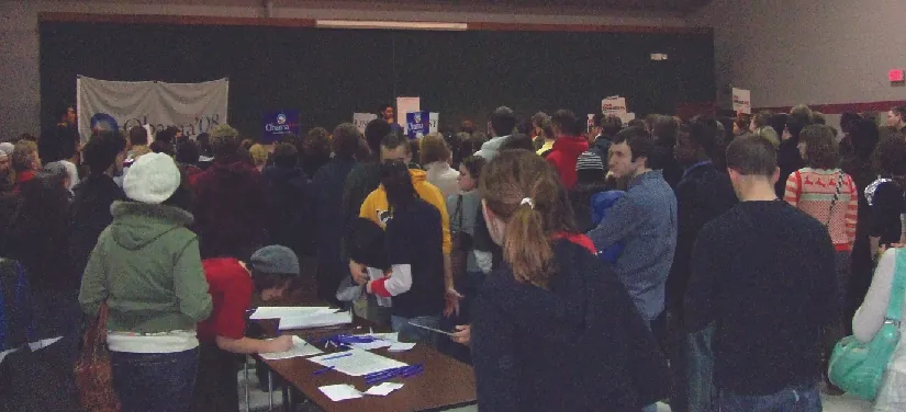 An image of a group of people standing in a room.