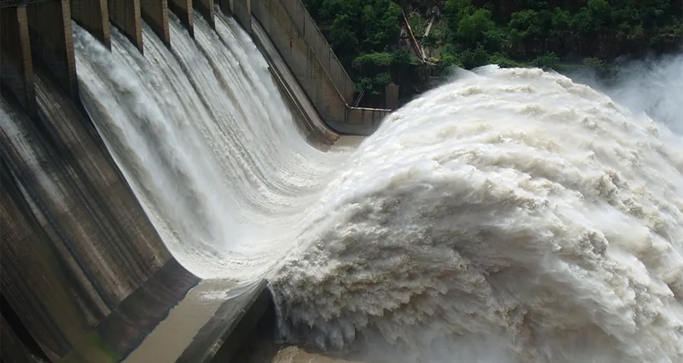 Water is shown flowing through a hydroelectric facility.