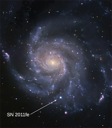 Type Ia Supernova. The very bright star to the left of center is a type Ia supernova at the outskirts of the spiral galaxy seen at upper right.