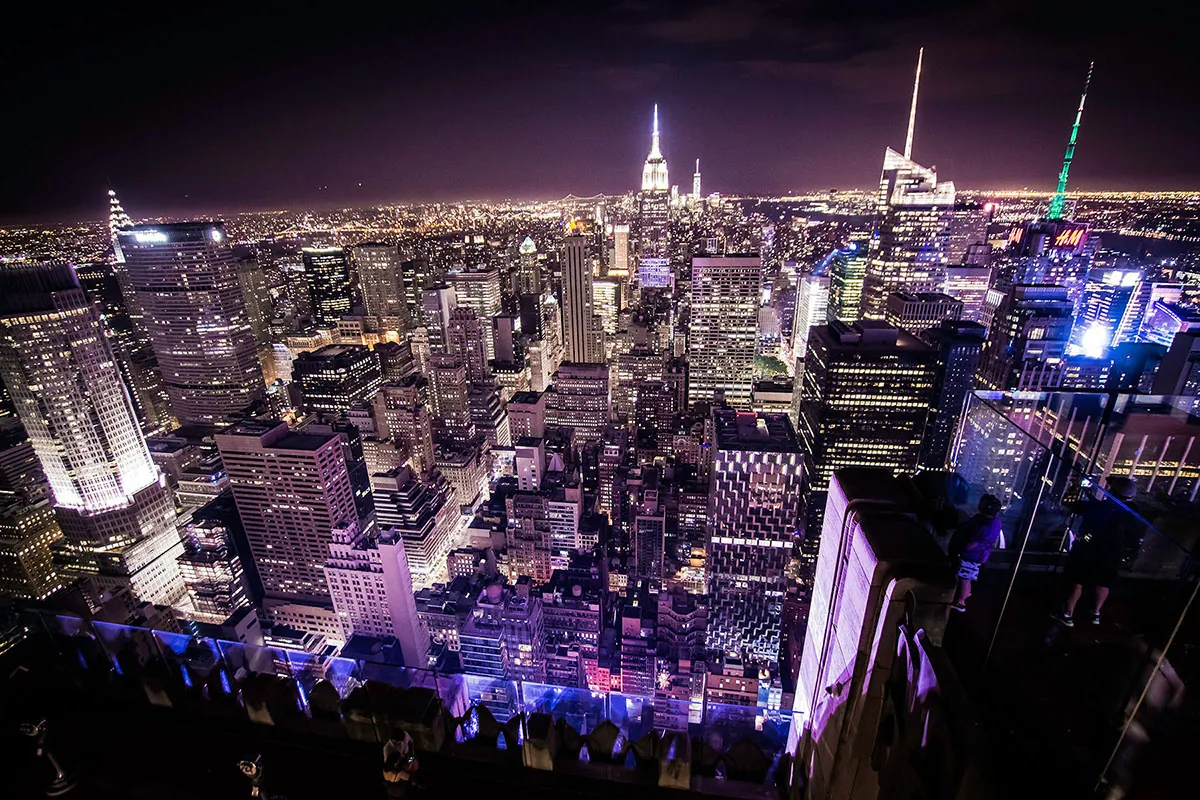 The New York City skyline at night is shown here.