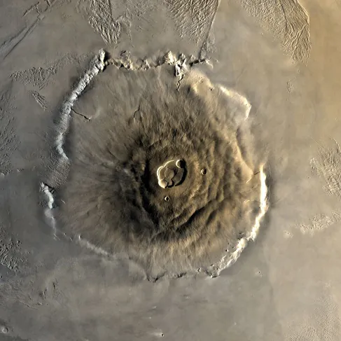 An overhead image of the volcano Olympus Mons on Mars, with a crater at the top.