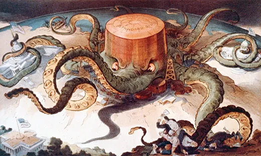 A cartoon shows a massive octopus labeled “Standard Oil.” The octopus’s tentacles wrap around a series of tiny buildings and structures, indicating that it controls the steel, copper, and shipping industries; the U.S. Capitol; and a state house. A final tentacle seeks the White House, but has not yet reached it.