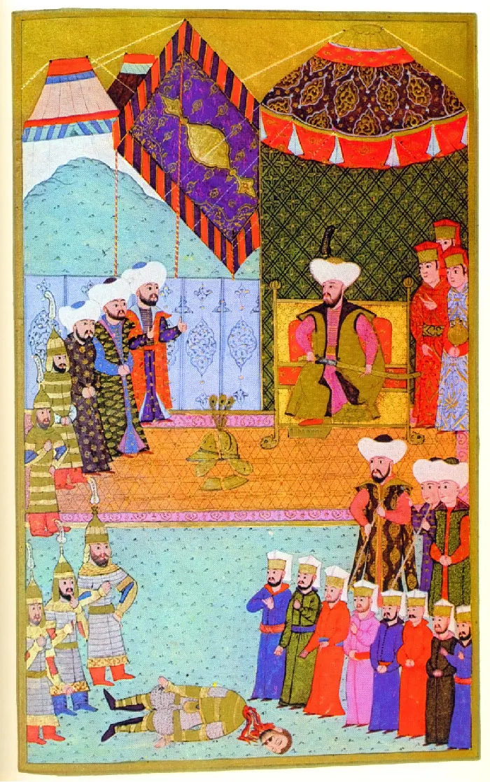 A richly colorful image is shown within a mustard colored rim. In the right middle of the image, a figure sits on a gold and orange throne in long pink, brown and black robes with a white and black tall turban on his head. He holds a long sword across his lap. Behind him are tall richly decorated tents anchored with gold ropes amid blue mountains. Behind the figure at his left stand three figures in long blue and red robes with tall gold headdresses covered in red cloths. To the right of the seated figures stand three men in long richly decorated robes and bright white turbans and two soldiers in striped green outfits with matching helmets and orange boots. On the orange triangle patterned floor with pink edges in front of them lies a golden helmet in pieces. In the bottom third of the image is a pale blue floor with black tick marks. At the left forefront stand three soldiers in green and yellow striped tall helmets with a long white feather at the top, gray and gold armor, and orange and blue boots. They look at a figure in front of them on the ground. The figure on the ground wears green and gray striped armor, black boots, and has brown hair and a dark moustache. The head of the figure is separated from its body and red blood is oozing out from both parts. In the right forefront of the image eight people in solid colored robes and gold hats with white cloths on top are standing in a row looking at the beheaded figure. Behind them stand three people in richly decorated robes in rich colors with bright white turbans on their heads, two holding long sticks.