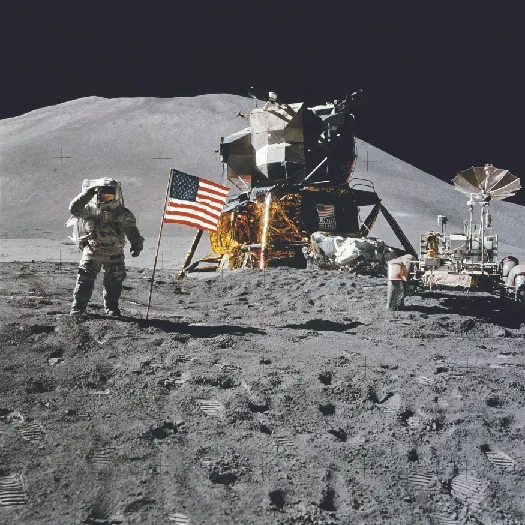 A photo of an astronaut on the moon standing next to the American flag.